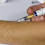 医療従事者への3回目接種、コロナ感染リスク99％減／JAMAのイメージ